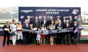 HKJC Chairman Dr Simon Ip (back row, 1st from right); HKJC Stewards; Chief Executive Officer Winfried Engelbrecht-Bresges (back row, 1st from left); Karen Au Yeung, Vice President of LONGINES HK and connections of LONGINES Jockey Club Cup winner Blazing Speed  pose for a group photo at the presentation ceremony.