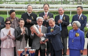 At the presentation ceremony, Dr Y C Chow, Chairman of Chevalier International Holdings Limited, presents the Chevalier Cup trophy to All You Wish��s owner Chan Fut Yan and Carmen Chan Wing Yee.