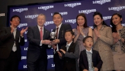 Mr Winfried Engelbrecht-Bresges (second from left), Chief Executive Officer of the HKJC, presents a trophy of final leg of the 2014 Global Sprint Challenge to Daniel Yeung Ngai, owner of the winning horse in the LONGINES Hong Kong Sprint.