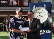 The Hon Abraham Shek Lai-him (right), Member of the Legislative Council (Real Estate and Construction) of the Hong Kong Special Administrative Region, presents a prize of HK$5,000 to the groom responsible for Able Friend, the Best Turned Out Horse in the LONGINES Hong Kong Mile.