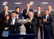 Photo 9,  10<br>
The Hon Lam Woon Kwong (right), Convenor of the Non-official Members of the Executive Council of the HKSAR, presents the LONGINES Hong Kong Cup trophy and a bronze statuette of a horse and jockey to owner representative of Designs On Rome.
