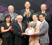 Photo 8, 9, 10<br>Mr Michael T H Lee, a Steward of the Club, presents the Queen's Silver Jubilee Cup trophy and gold-plated dishes to Dr & Mrs Cornel Li Fook Kwan, Owner of Able Friend, winning trainer John Moore and jockey Joao Moreira. 