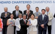 May Tan, Chief Executive Officer, Hong Kong, Standard Chartered, presents a souvenir to winning trainer Tony Cruz.