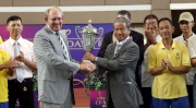 Trainer Tony Cruz (right) receives the trophy for this season's Safest and Best Housekeeping Stable Award from Director of Racing Operations and Chairman of the Safety Committee (Racing Operations and Racing Development Board) John Ridley (left)  at Sha Tin racecourse today.