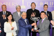 Photo 4, 5, 6<br>
Mr Daniel Yeung Ngai (right), a Club Member and an Owner, presents the trophy and a silver dish to Sidney Chiu, the winning owner of Berlini, trainer David Hall and jockey Gerald Mosse. 