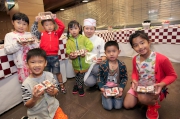 Children learn from the experienced Club chef to make cookies to share with their families.