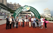 Connections of Amazing Kids pose for a winning photo in the winner??s circle.