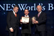 Mr. Juan-Carlos Capelli (left), Vice President of LONGINES and Head of International Marketing and Mr. Louis Romanet (right), Chairman of the International Federation of Horseracing Authorities (IFHA) co-present a trophy to Mr. Frankie Dettori, LONGINES World��s Best Jockey in 2015, at the gala dinner of the LONGINES Hong Kong International Races held tonight at the Hong Kong Convention & Exhibition Centre.