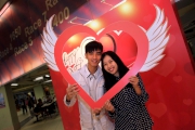 Couples capture the day��s romance with a snap shot in the Valentine��s Photo Zone.