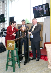 Anthony Kelly, Executive Director, Racing Business and Operations of the Hong Kong Jockey Club (right), and Kwang Eng Seong (left), Operations Controller of the Macau Jockey Club, jointly draw the number of first horse in the Hong Kong Macau Trophy barrier draw ceremony at Sha Tin this morning.
