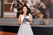 Ms. Gloria Lo, owner representative of Military Attack, draws Gate 9 for her horse.