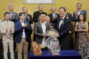 Photo 4, 5, 6<br>
Mr Philip N L Chen (front row, first from right), Steward of the Hong Kong Jockey Club, presents the Trophy and silver dish each to owner representative of Design On Rome, trainer John Moore and jockey Karis Teetan.
