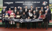 HKJC Chairman Dr Simon Ip; HKJC Stewards; Chief Executive Officer Winfried Engelbrecht-Bresges; Karen Au Yeung, Vice President of LONGINES HK and connections of LONGINES Jockey Club Cup winner Secret Weapon pose for a group photo at the presentation ceremony.