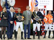 Club Chairman Dr Simon Ip (third right) and Club Chief Executive Officer Winfried Engelbrecht-Bresges (second left) present prizes to the winners of the HKJC Race of the Riders, jockey Joao Moreira (third left) and French rider Roger-Yves Bost (second right).