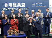 Photos 5, 6, 7<br>
At the trophy presentation ceremony, Club Steward Silas S S Yang (right) presents the Hong Kong Classic Cup trophy and gold-plated dishes to Rapper Dragon��s owner Albert Hung Chao Hong, trainer John Moore and jockey Joao Moreira.